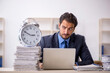© Elnur - Young male employee in time management concept