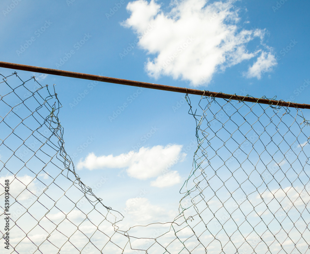 Broken metal mesh fence Stock Photo | Adobe Stock