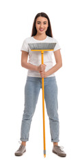 Canvas Print - Beautiful young woman with broom on white background