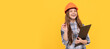 © Olena - building and construction. happy child worker wear hardhat hold clipboard. childhood development. Child in hard hat horizontal poster design. Banner header, copy space.