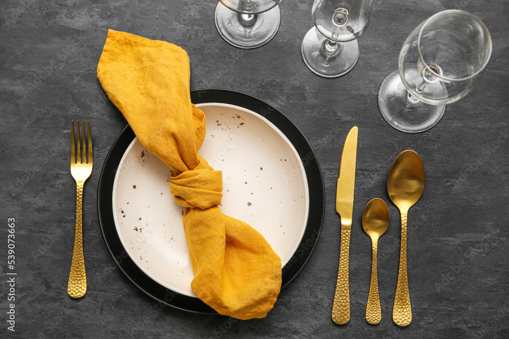 Modern table setting on black background