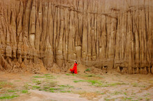 Women And Landscape Of Soil Textures Eroded Sandstone Pillars, Columns And Cliffs, Natural Erosion Of Water And Wind, Sao Din Na Noi, Hom Chom, Khok Suea At Sri Nan National Park In Nan Province.