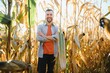 © Serhii - A man inspects a corn field and looks for pests. Successful farmer and agro business