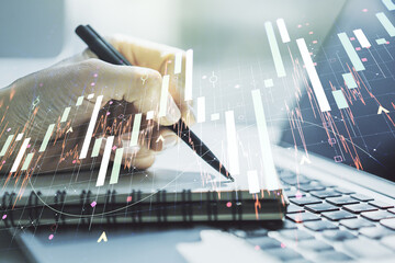 Multi exposure of abstract creative financial chart with hand writing in diary on background, research and analytics concept