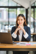 © Kritdanai - business woman or accountant who are using a calculator to calculate business data Accounting documents and laptop computer at the office business idea