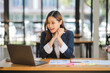 © Kritdanai - business woman or accountant who are using a calculator to calculate business data Accounting documents and laptop computer at the office business idea