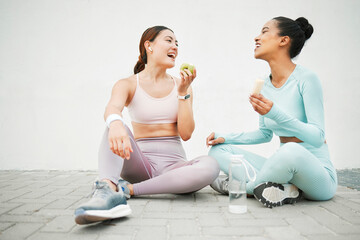 Poster - Fitness women, laughing and eating fruit on training, weight loss exercise and workout break by Canada city wall. Smile, happy and bonding sports people or friends with apple, banana and health food