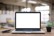 © RAYBON - Desk Laptop with blank screen on table  blur background with bokeh background that is used for editing