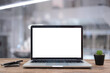 © RAYBON - Desk Laptop with blank screen on table  blur background with bokeh background that is used for editing