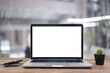 Desk Laptop with blank screen on table  blur background with bokeh background that is used for editing