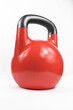 © Stephen - Classic red heavy cast iron kettlebell shot in a white studio.