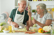 © aletia2011 - Beautiful elderly couple preparing salad in the kitchen