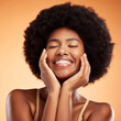 Beauty, face and skincare with a model black woman in studio on an orange background with a joyful or carefree expression. Cosmetics, skin and health with a happy young female posing for wellness