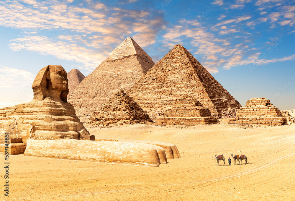 The Great Sphinx next to the Pyramids of Egypt in the desert of Giza ...