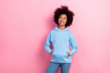 Canvas Print - Photo of pretty satisfied girl wear blue stylish hoodie interested look empty space offer sale news isolated on pink color background