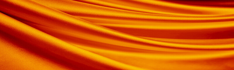 Wall Mural - Orange silk satin curtain. Bright luxury background. Design. Shiny golden draped fabric, folds. Wavy lines. Flowing. Liquid, ripple. Valentine, Mother's day, festive. Banner. Wide. Long. Panoramic.