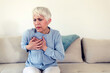 © Jelena Stanojkovic - Heart health care. Close-up of mature woman feeling strong pain in chest. Female body with hand on chest. Women suffering from painful feeling, having health issues.