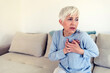 © Jelena Stanojkovic - Heart health care. Close-up of mature woman feeling strong pain in chest. Female body with hand on chest. Women suffering from painful feeling, having health issues.