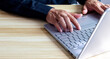 © Alek - success businessman hand working with digital tablet docking smart keyboard on wooden desk,filter effect