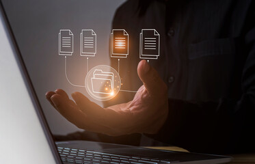 Hands of a businessman using a laptop with big data icons data analysis concept Storage and management of information, including analyzing business information.