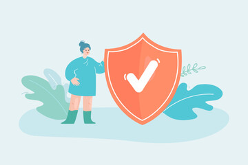 Wall Mural - tiny cartoon woman standing next to orange shield with checkmark. internet privacy or safety flat ve