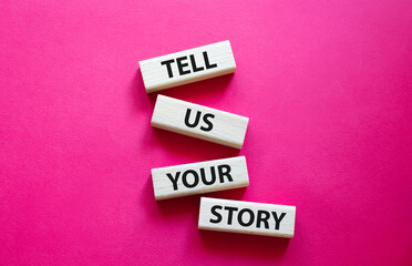 Tell us your story symbol. Concept words Tell us your story on wooden blocks. Beautiful red background. Business and Tell us your story concept. Copy space.