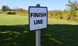 © Al - A close view of the black and white finish line sign.