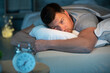 © auremar - young man in bed with eyes opened suffering insomnia