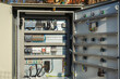 © RasaBasa - Electric control panel outside. Waste water equipment electrical automation cabinet. Open box with wires, contacts and terminal blocks close-up.