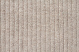 Fototapeta Tulipany - Light beige woolen knitted fabric texture. Macro.