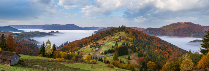 Wall Mural - Foggy early morning autumn mountains scene. Peaceful picturesque traveling, seasonal, nature and countryside beauty concept scene. Carpathian Mountains, Ukraine.