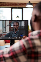 Wall Mural - Startup employee talking on videocall conference, meeting with colleague on online teleconference chat with webcam on computer. Using remote videoconference call on internet, working remotely.