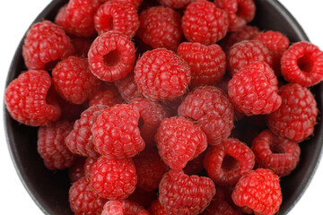 Sticker - Raspberries much in bowl close-up.