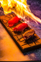 Canvas Print - sushi baked on a gray background in a restaurant