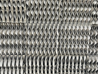 The texture of the iron stainless metal grate of the nozzle of the plate for the industrial chemical column background