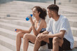 © Oleksandr - Two young people resting after workout and looking relaxed