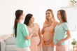 Young pregnant women talking at course for expectant mothers