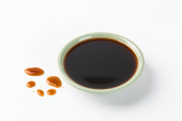 Bowl with traditional vinegar on white background.