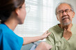 © sorapop - Doctor woman examines lymph nodes on elderly neck to determine if swollen, sore throat, Asian young nurse checking senior old man neck pain in clinic at retirement home, physical therapist