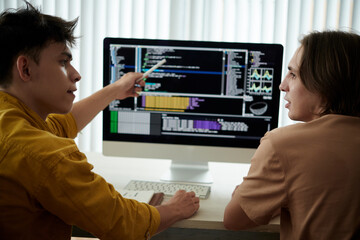 students discussing programming code