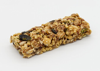 Wall Mural - Protein bar with whole grains peanuts and cranberries isolated on white background.