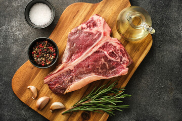 Wall Mural - T-bone or porterhouse raw steak of beef cut from the short loin. Steak include T-shaped bone with meat on each side. Porterhouse steaks are cut from the rear end of the short loin.