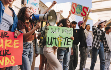 Wall Mural - Youth demonstrators fighting for climate justice in the city