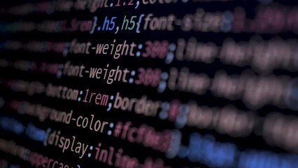 Wall Mural - 4k close-up shot programming tag code on pc monitor scroll down. background concept for programming 