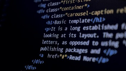 Wall Mural - 4k close-up shot html tag code on pc monitor scroll down. background concept for programming and cod