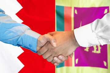 Wall Mural - Business handshake on background of two flags. Men handshake on background of Bahrain and Sri Lanka flag. Support concept