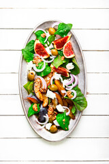 Wall Mural - Healthy salad with fruit, olives and herbs