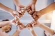© Anela R/peopleimages.com - Fist bump, team building and business people in a meeting with mission, our vision and growth mindset in a circle. Below, huddle and hands of employees with group goals, targets and global support