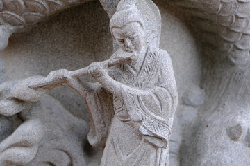 close up stone chinese statue details in the temple