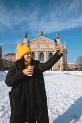 Poster - woman traveler drinking coffee to go taking selfie in front of opera building